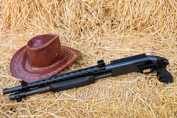 pump action shotgun 870 with con rice straw Background