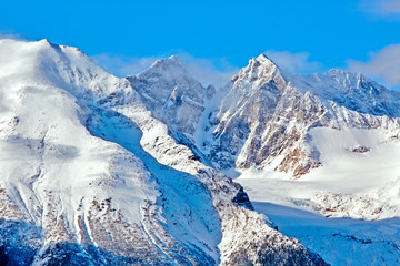 Fototapeta na wymiar Glacier surrounded by spectacular Mountain Peaks , B.C. Canada