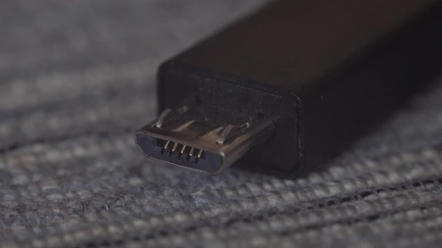 Closeup of smartphone charging with usb cable