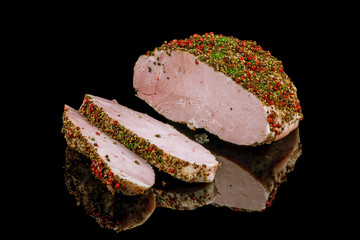 baked pork ham on black glass with reflection