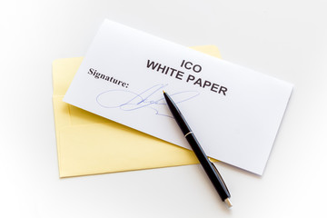 White paper ICO, pen on white background