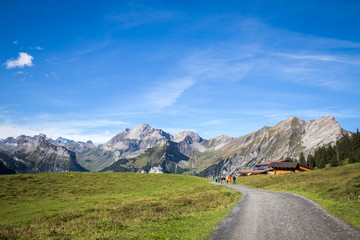 Backpack and mountain panorama. Swiss Alps