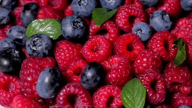Close Up Rotation Loopable Raspberry. Fresh, Juicy Raspberry Background, Ripe. Macro Red Raspberries Fruit. Fresh Raspberry Fruits As Food Dackground. Healthy Food Organic Nutrition.