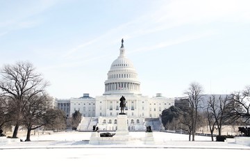 The US Capitol Building in Washington DC on a sunny winter day after a heavy snow with no people. - Powered by Adobe