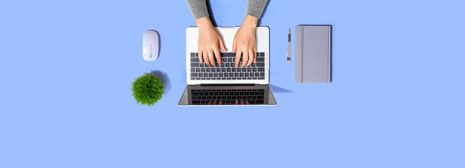 Person using a laptop computer from above