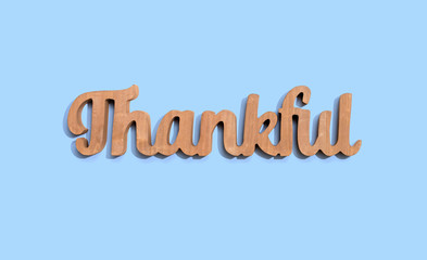 Fototapeta premium Thankful wooden text from above - overhead view