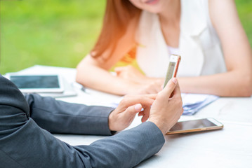 Businessmen and women are sitting in contact with customers