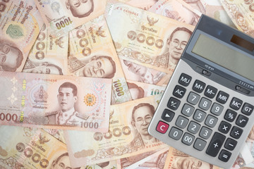 1000 Thai Baht banknote background with Calculator. business, investment, retirement planning,...