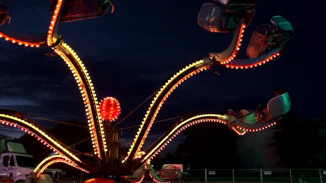 A slow motion shot of spinning carnival ride