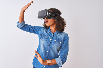 Young african american teenager girl playing virtual reality game using goggles