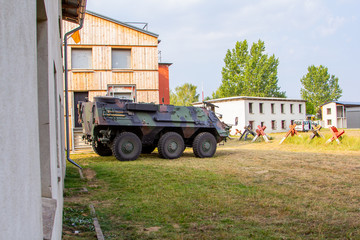 Armoured personnel carrier from german army stands in a military training area