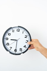 man hand holding clock