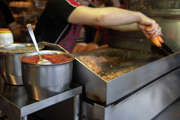 chef preparing  kokorech bread on the street in restaurant