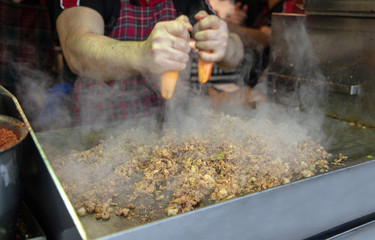 chef preparing  kokorech bread on the street in restaurant