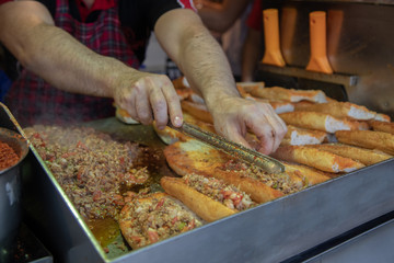 chef preparing  kokorech bread on the street in restaurant