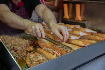chef preparing  kokorech bread on the street in restaurant
