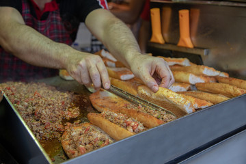 chef preparing  kokorech bread on the street in restaurant
