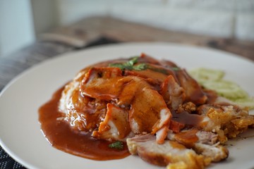 Barbecued red pork and crispy pork with sauce and rice