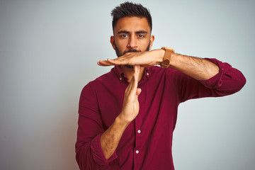 Young indian man wearing red elegant shirt standing over isolated grey background Doing time out...