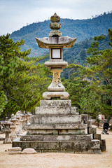 Obraz premium Large stone lantern on a pedestal at a temple in Japan