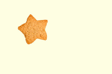 Cookie star for Christmas isolated on cream background. Baking christmas cookie