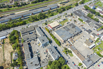 aerial top view of roofs of industrial buildings. manufacturing companies and factories at urban industrial area