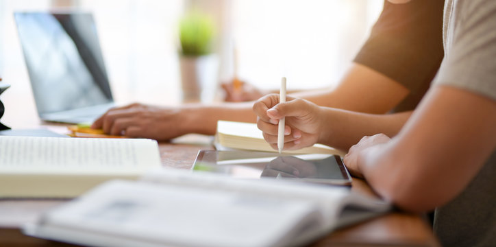 Close-up view of university students discussing their group project