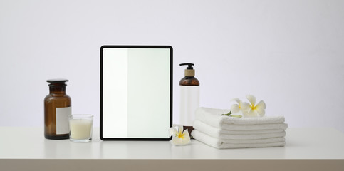 Blank screen tablet with spa aromatherapy concept table