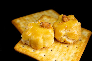 Cracker cookies on dark background.