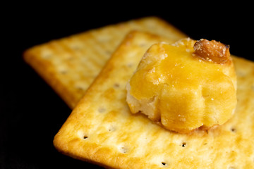 Cracker cookies on dark background.