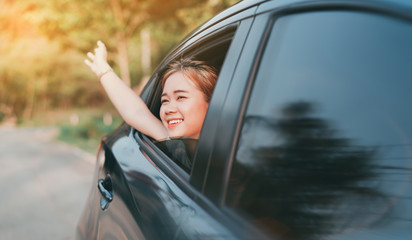 Hatchback Car travel driving road trip of asian woman summer vacation in blue car at sunset,Girls happy traveling enjoy holidays and relaxation with friends together get the atmosphere