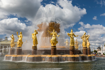 The Peoples Friendship Fountain in VDNKh park in Moscow. Amazing sunny view of the Soviet architecture, landmark of Moscow. Beautiful luxurious old fountain in summer. - 286418289