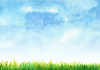 Obraz premium Zielona trawa wypełniona niebieskim niebem akwarela ręcznie malowana tło.