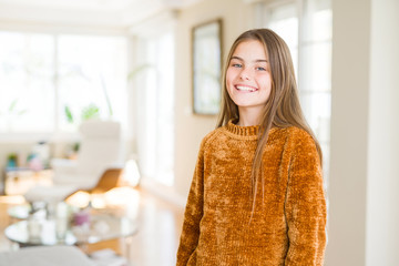 Beautiful young girl kid at home with a happy and cool smile on face. Lucky person.