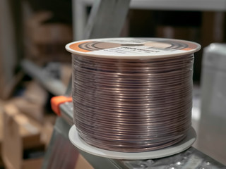 Copper wire wound into a coil in the electrical  Copper wire electrical coiled in a coil