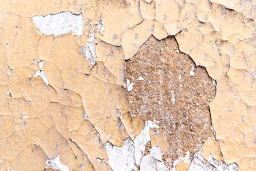 background yellow cracked peeling paint on wall
