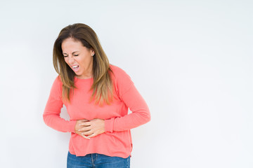 Beautiful middle age woman over isolated background with hand on stomach because indigestion, painful illness feeling unwell. Ache concept.