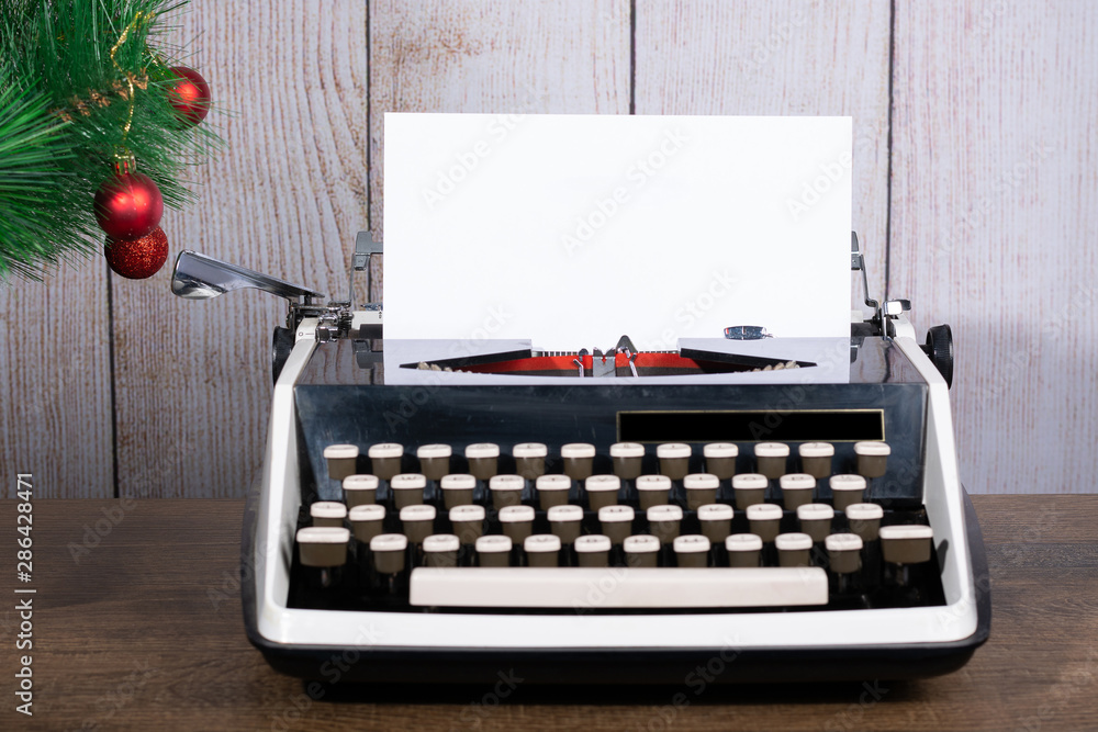 Fototapete retro typewriter with a blank sheet of paper for text. white new year and christmas background mock 
