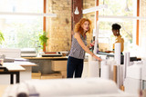 Two workers of publishing office working all day long