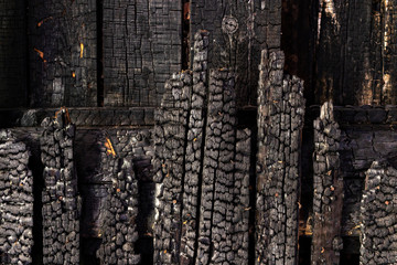 wall charred boards after fire