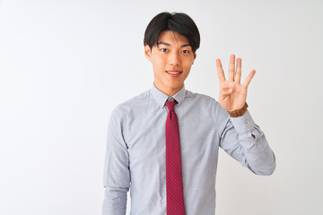 Chinese businessman wearing elegant tie standing over isolated white background showing and pointing up with fingers number four while smiling confident and happy.