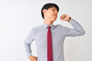 Chinese businessman wearing elegant tie standing over isolated white background stretching back, tired and relaxed, sleepy and yawning for early morning