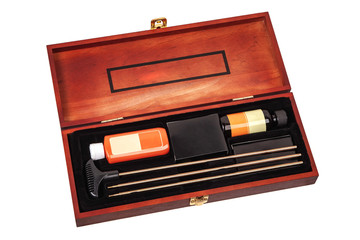 Set for cleaning weapons in a wooden case isolate on a white background. Weapon care tools. Luxury gift set.