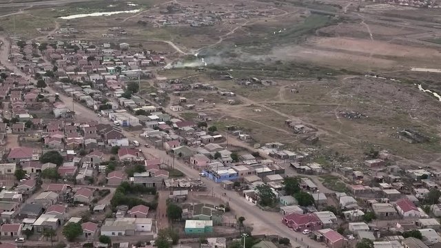 A large township in South Africa with low cost housing and informal shacks.