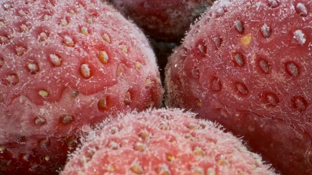Extreme closeup of fresh frozen strawberries, Rotation 360 degrees, Close-up