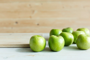 Green color apples on table