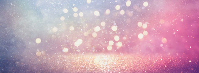 abstract glitter silver, purple, blue and gold lights background. de-focused. banner