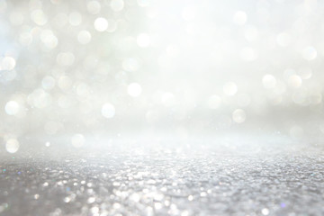 background of abstract glitter lights. silver and gold. de-focused