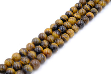 tiger eye stone beads necklace isolated on white background