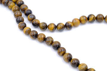 tiger eye stone beads isolated on white background